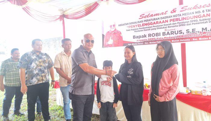 Sosperda Nomor. 6 Kota Medan Tahun 2023 tentang Penyelenggaraan Perlindungan Anak, Robi Barus Juga Bagikan Masker kepada Warga*
